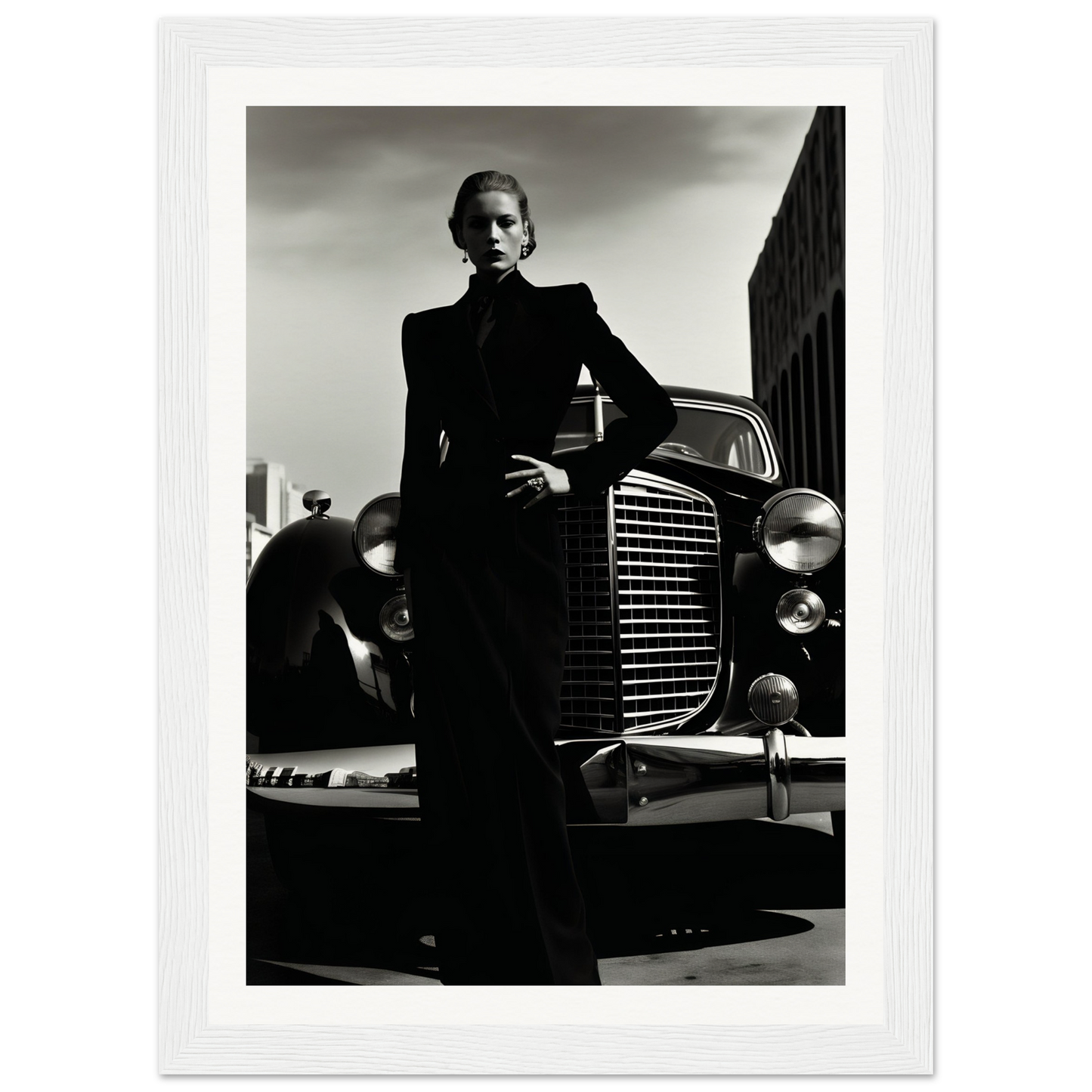 A black and white photo of a man in a suit leaning on a car