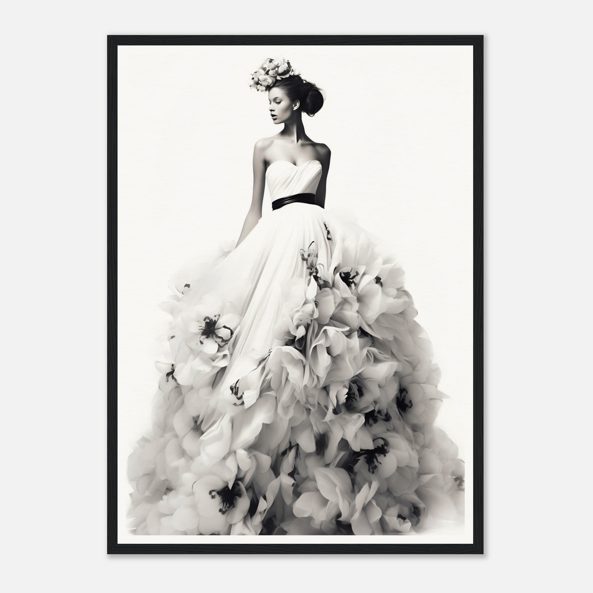 A black and white photo of a woman in a dress with flowers