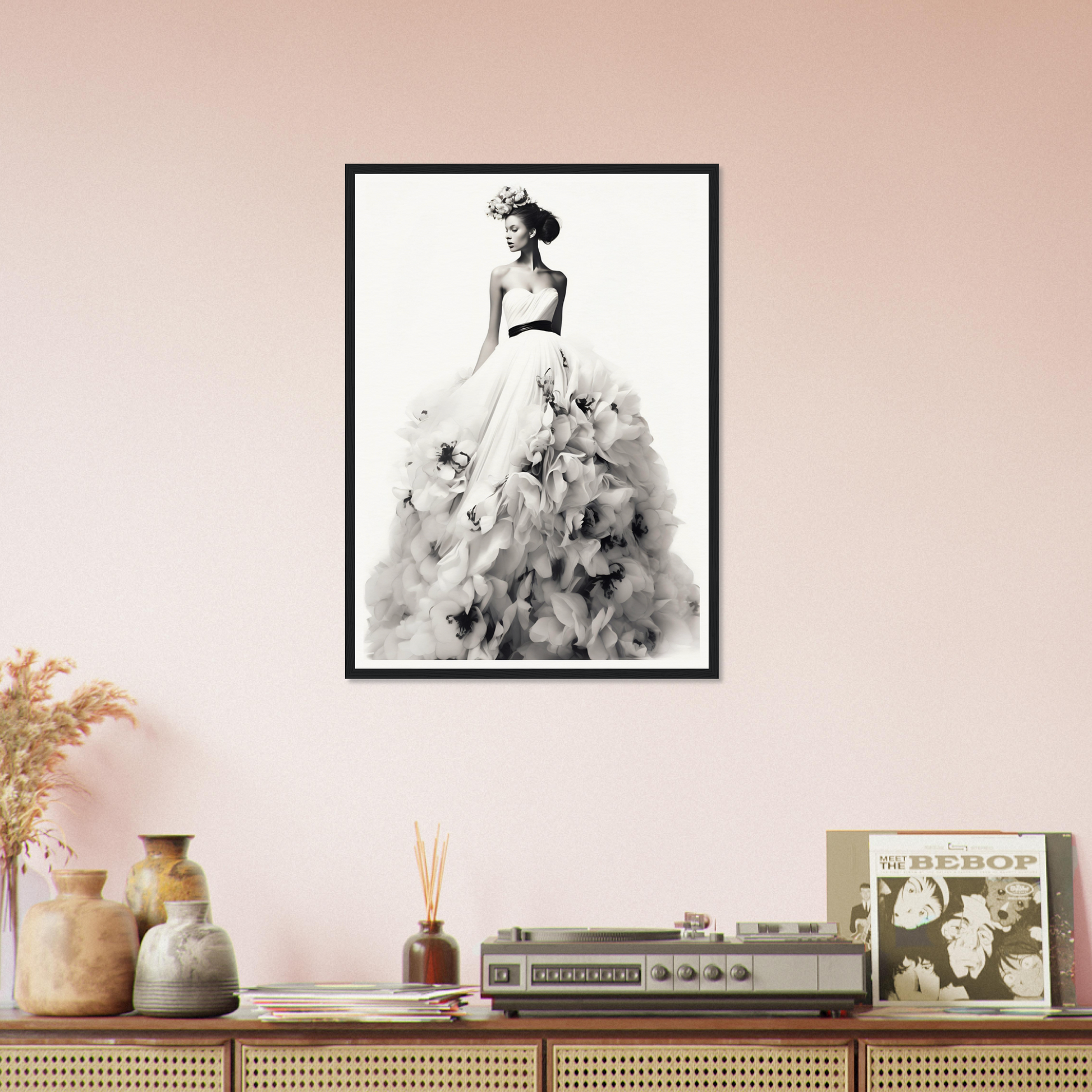 A black and white photo of a woman in a dress with flowers on her head