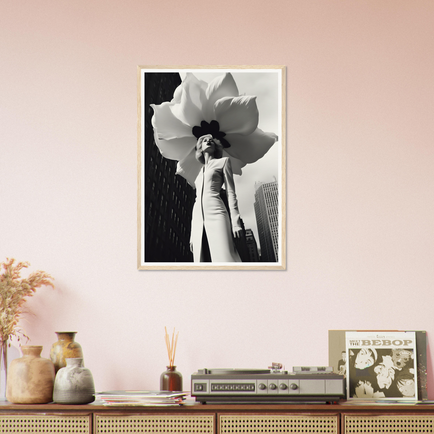 A black and white photo of a woman with a large flower in her hair