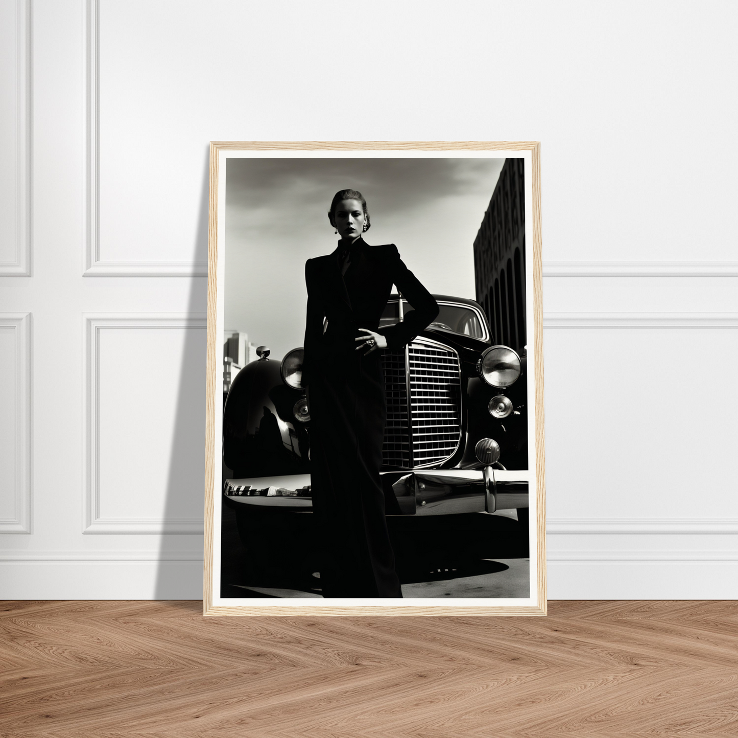 A black and white photograph of a man in a suit leaning on a car