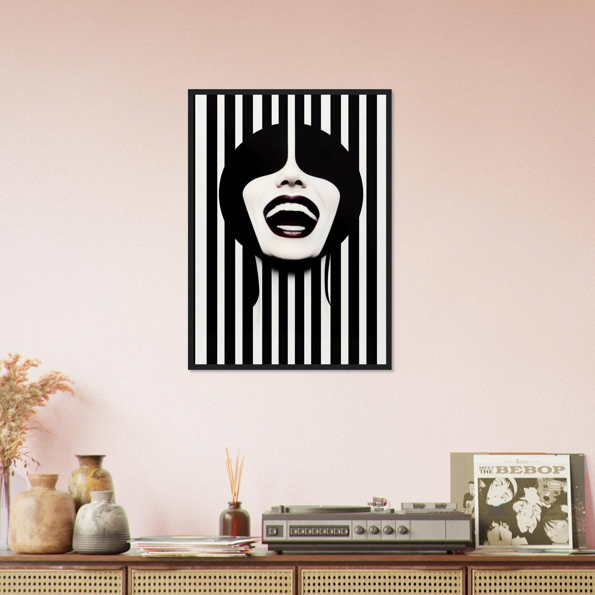 A black and white striped wall with a woman’s face in the middle