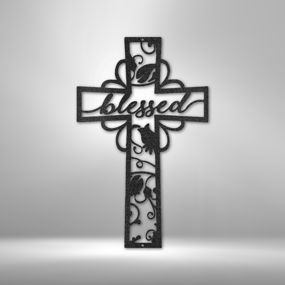 Decorative cross with the word ’blessed’ and floral designs cut out of black material.