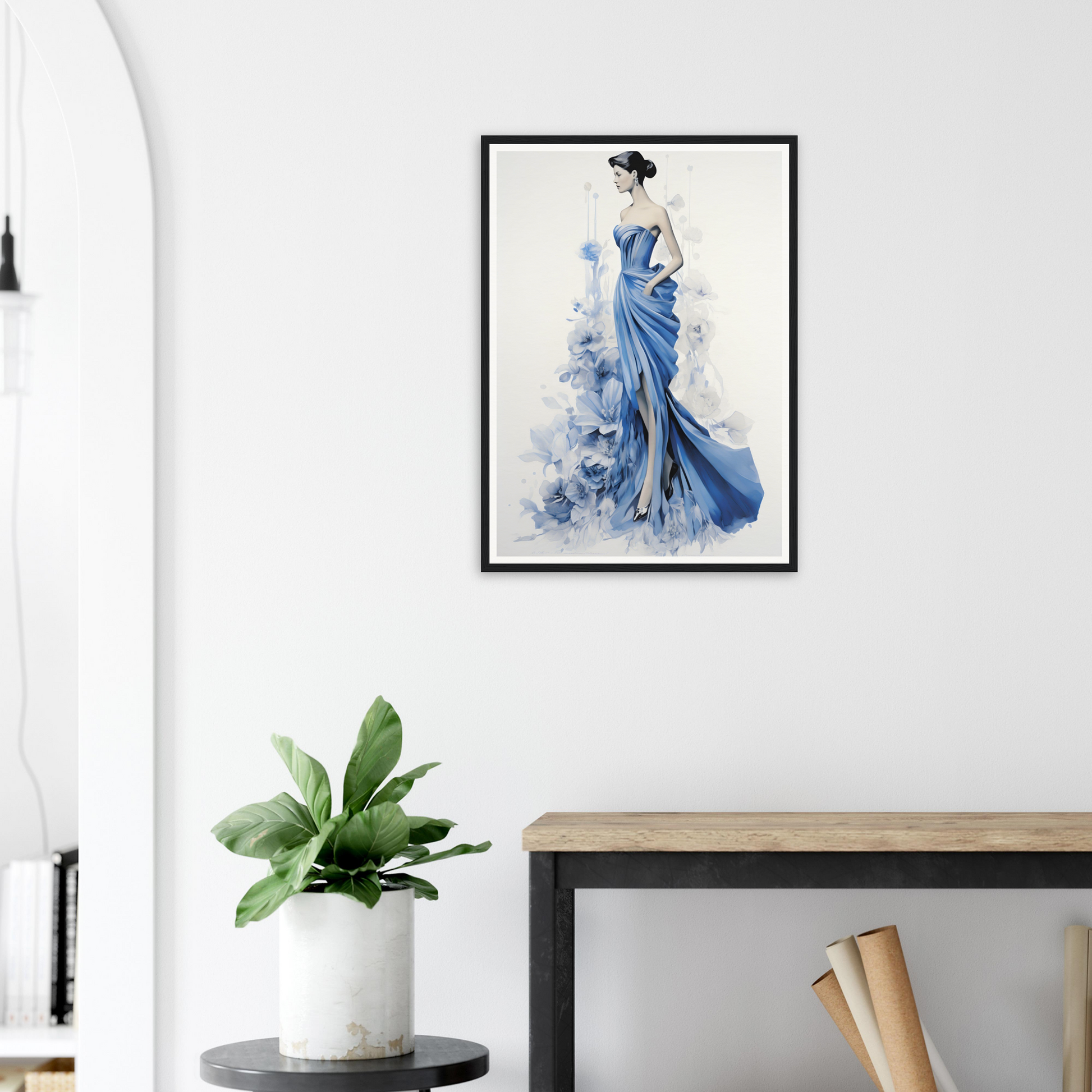 A blue dress with a white flower on the back and a black frame hanging above it