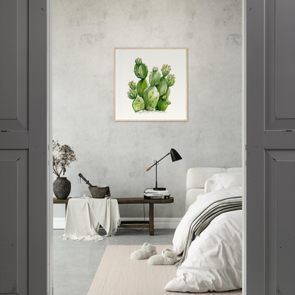 A cactus plant in a bedroom with a white bed