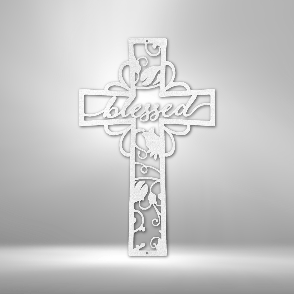 Ornate white cross with the word ’Blessed’ and floral designs.