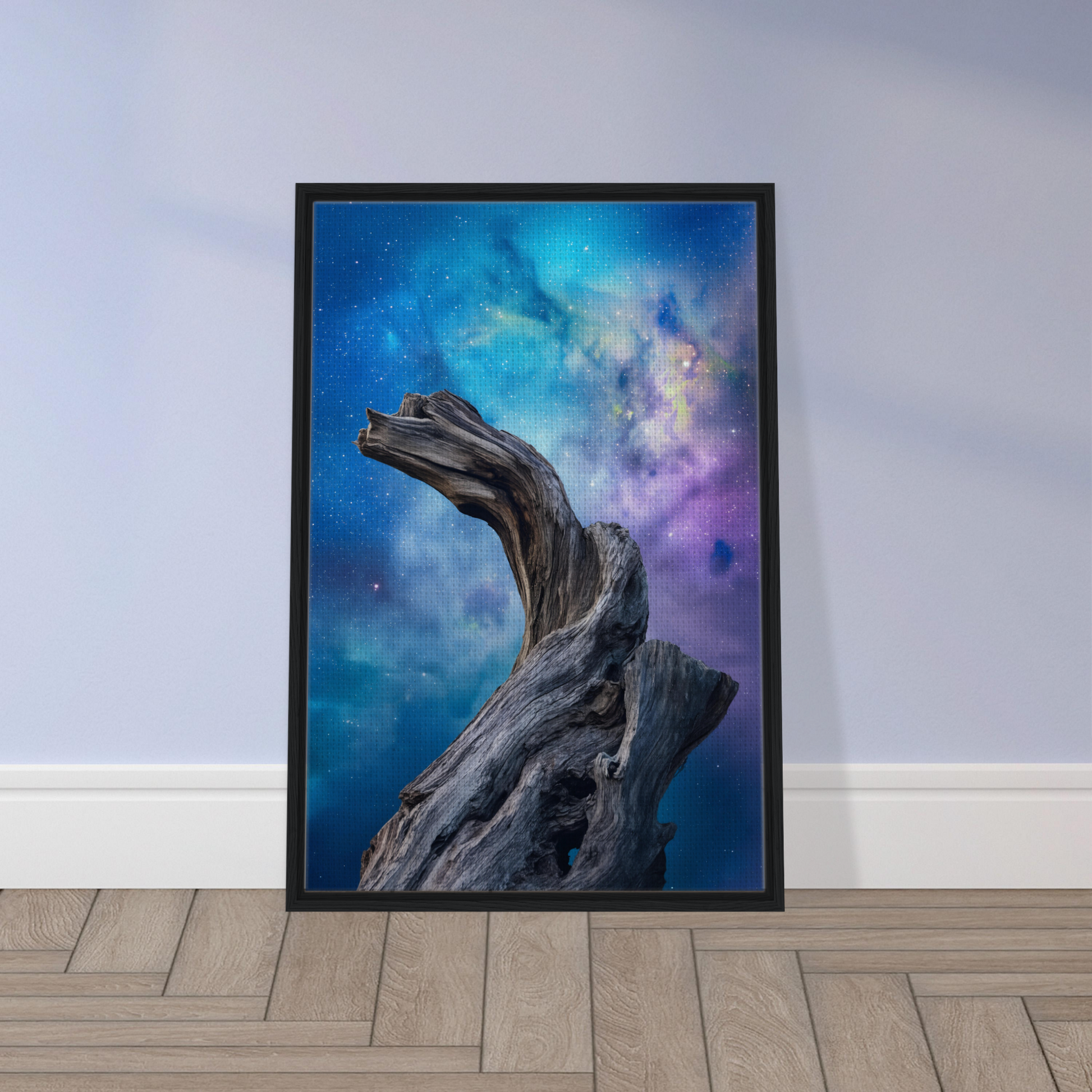 Twisted driftwood against a colorful cosmic sky in Celestial Drift Saga framed canvas print