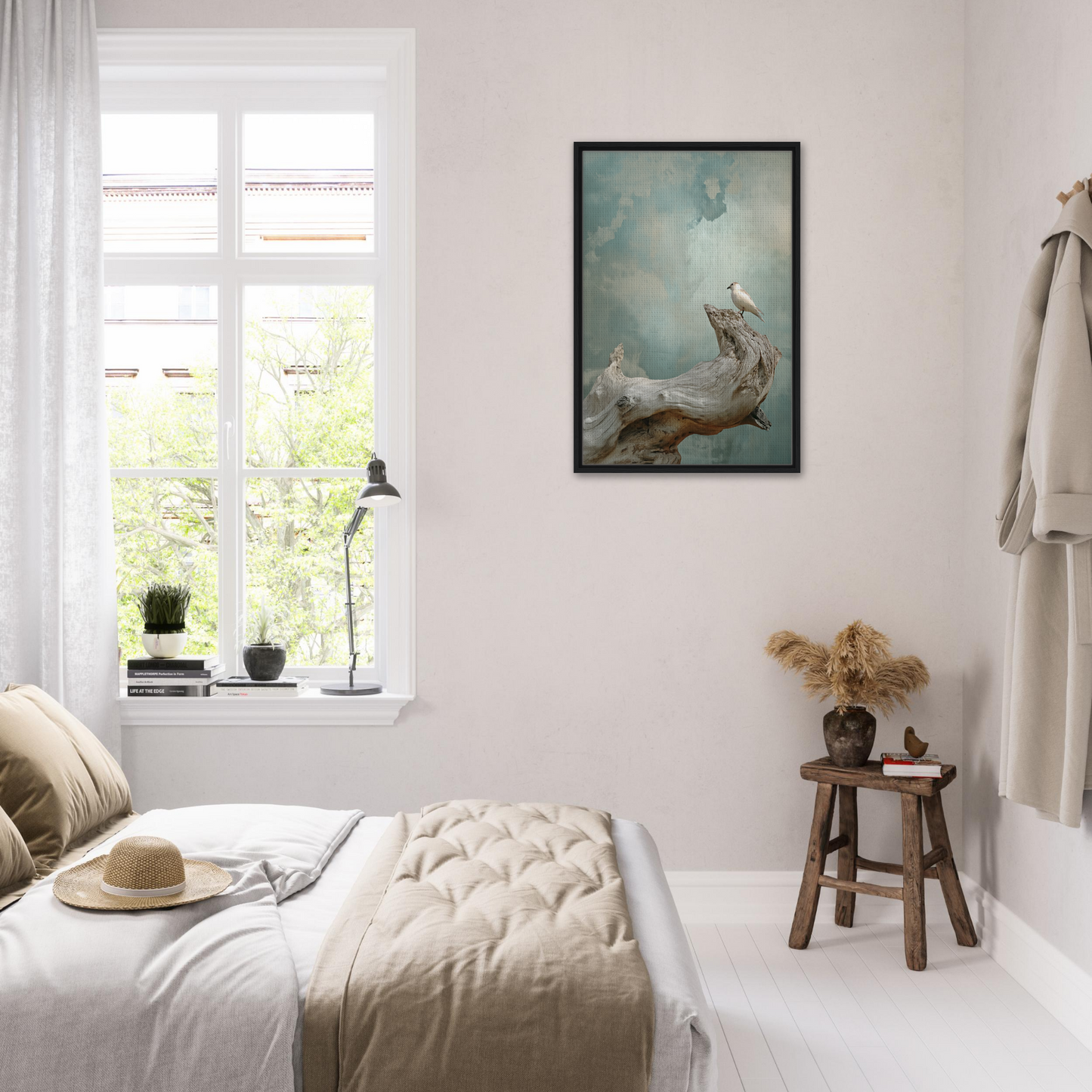 Bright bedroom with white walls, bedding, and a framed canvas print of Celestial Driftbird Devotion