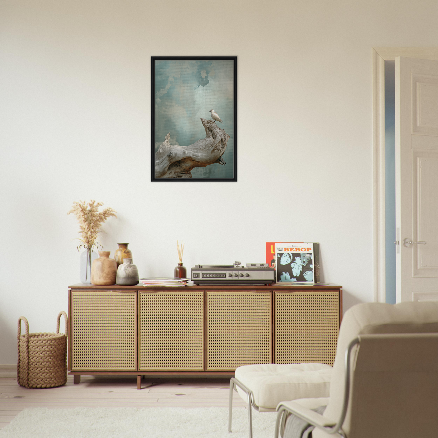 Wooden sideboard with cane-webbed doors and decorative items for celestial driftbird devotion