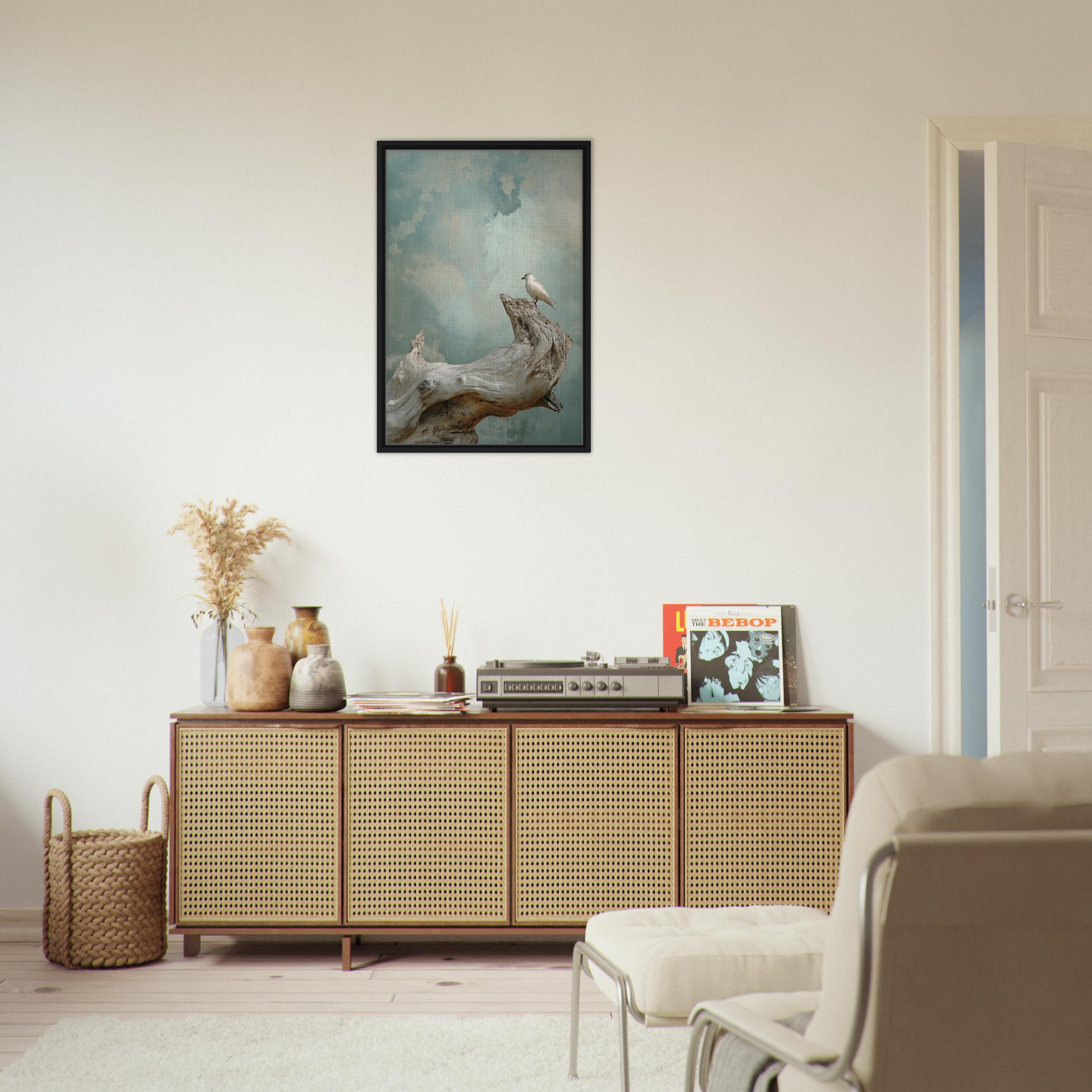 Wooden sideboard with cane-webbed doors and decorative items for celestial driftbird devotion