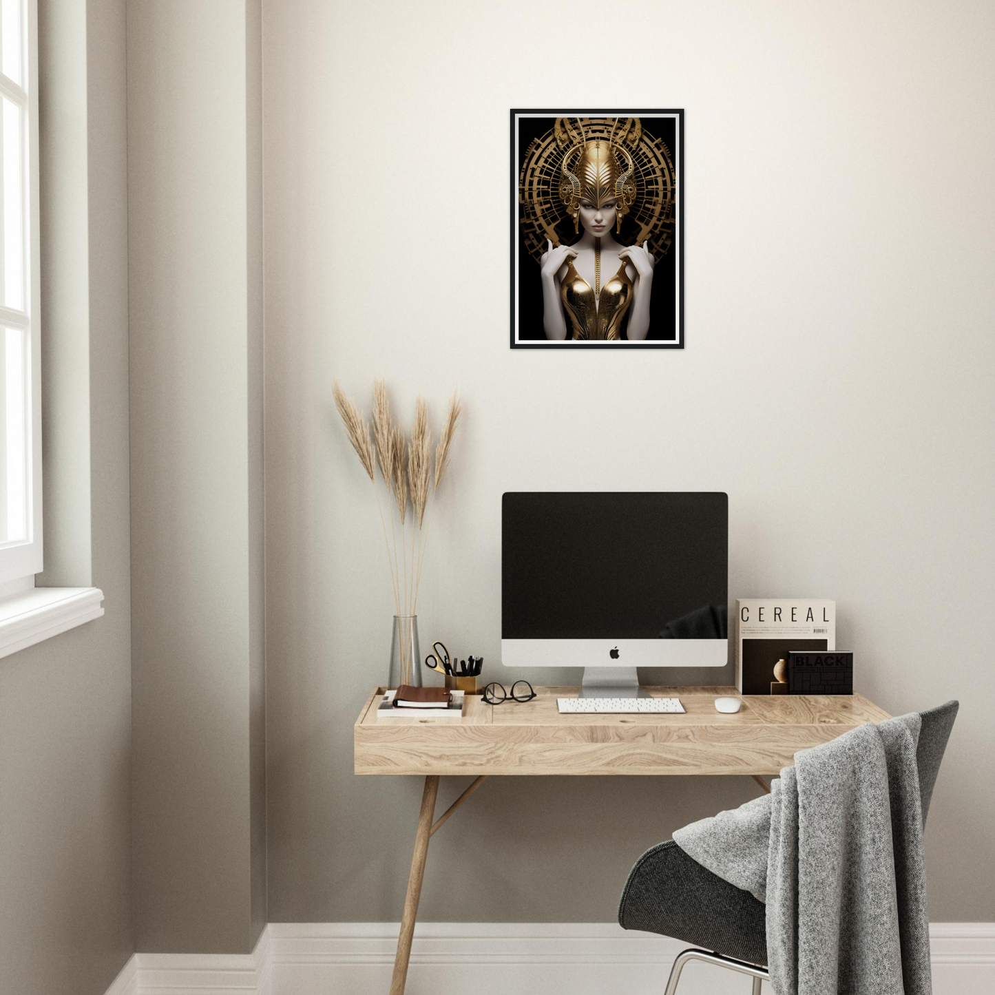 Minimalist home office workspace with a wooden desk, computer, and decorative artwork.