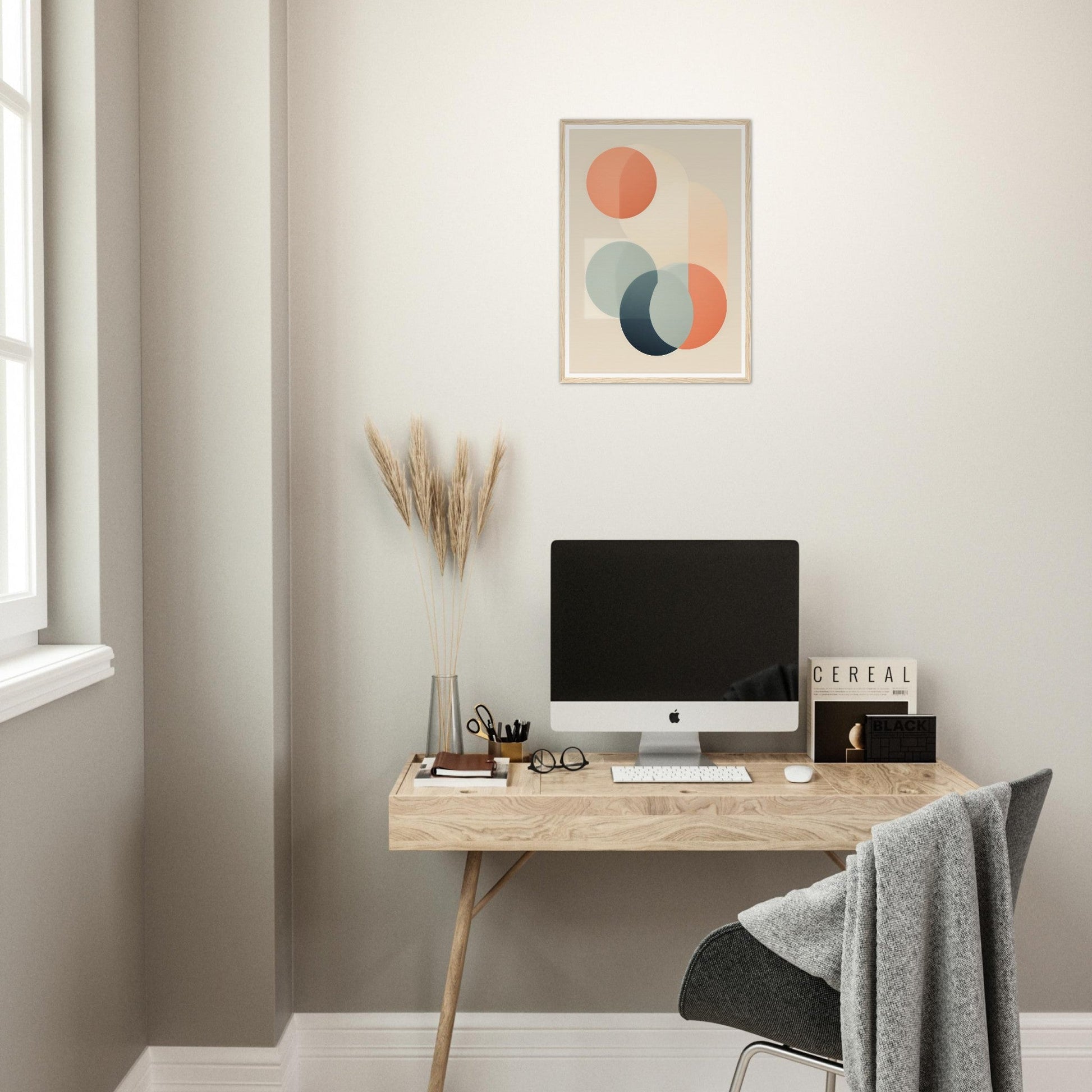 Wooden desk with a computer monitor, office supplies, and decorative elements.