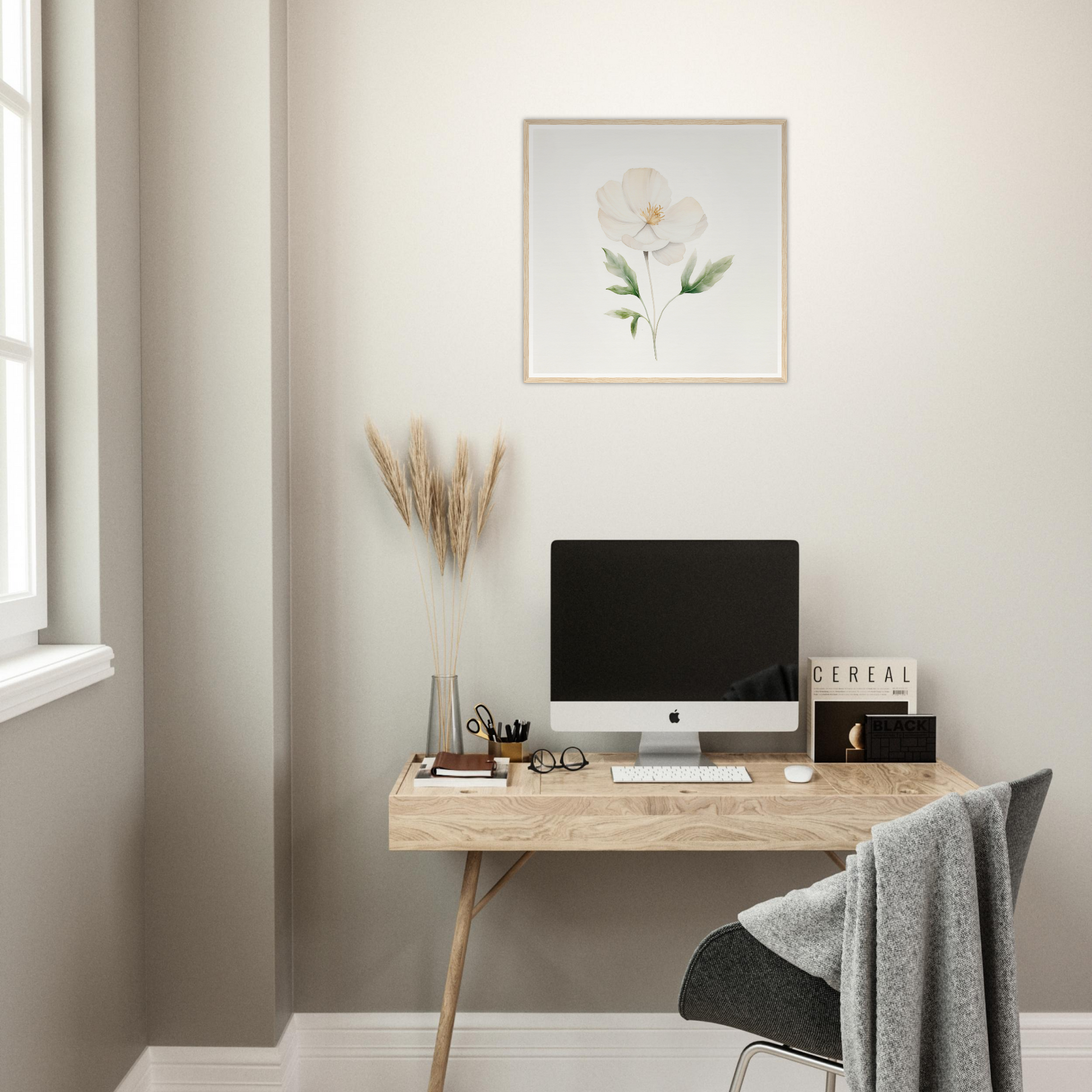 Minimalist wooden desk with a computer monitor and office accessories.