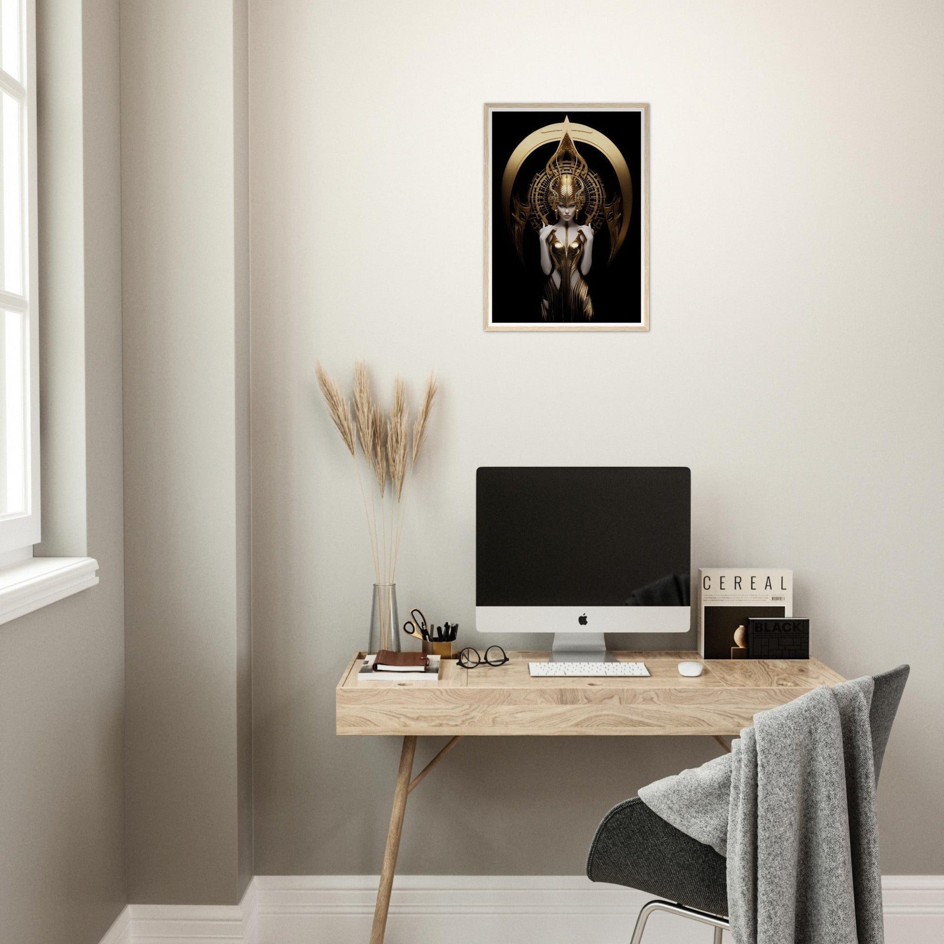 Minimalist home office workspace with a wooden desk, computer, and decorative wall art.