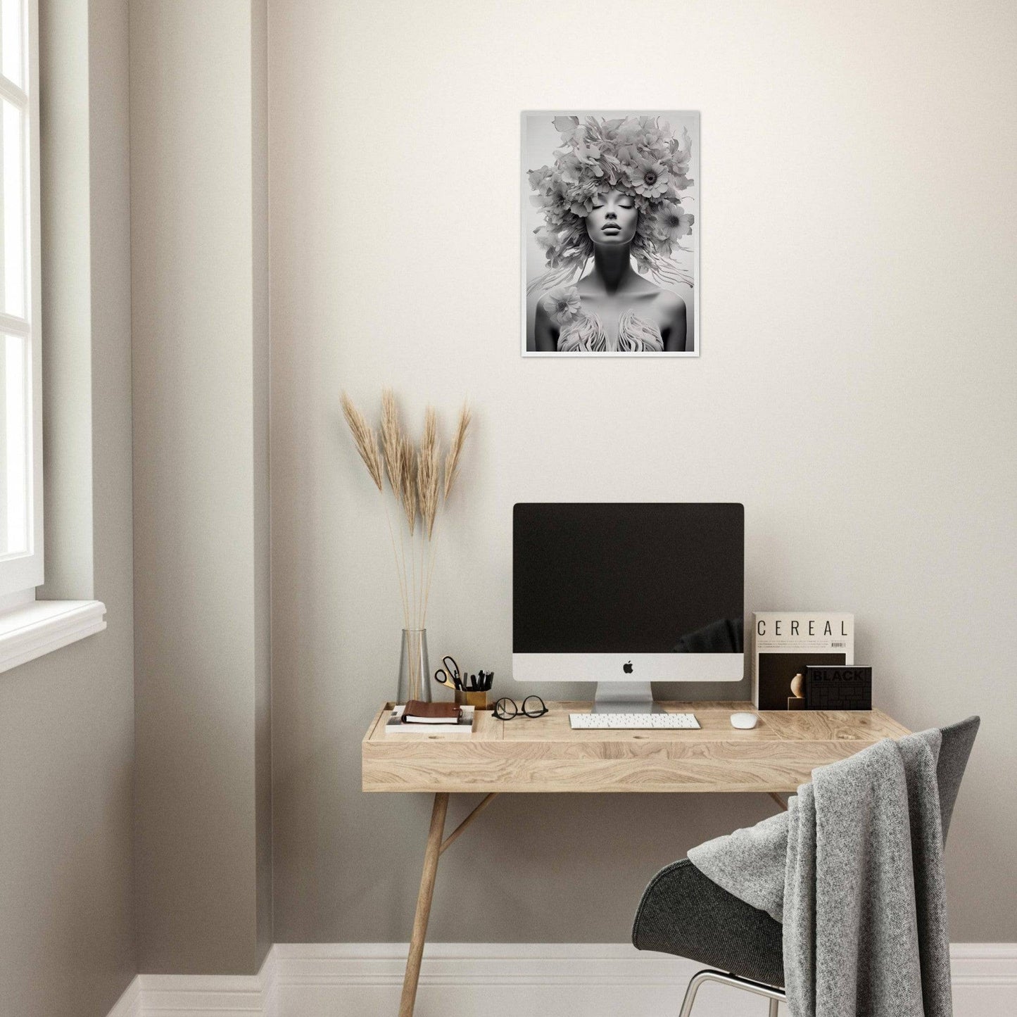 Minimalist wooden desk with a computer monitor and decorative accessories.