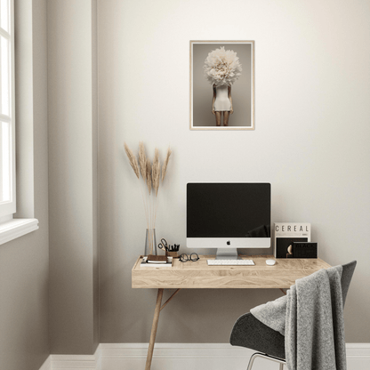 Minimalist wooden desk with a computer monitor and decorative accessories.