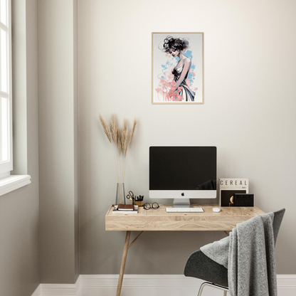 Minimalist home office workspace with a wooden desk, computer, and decorative artwork.