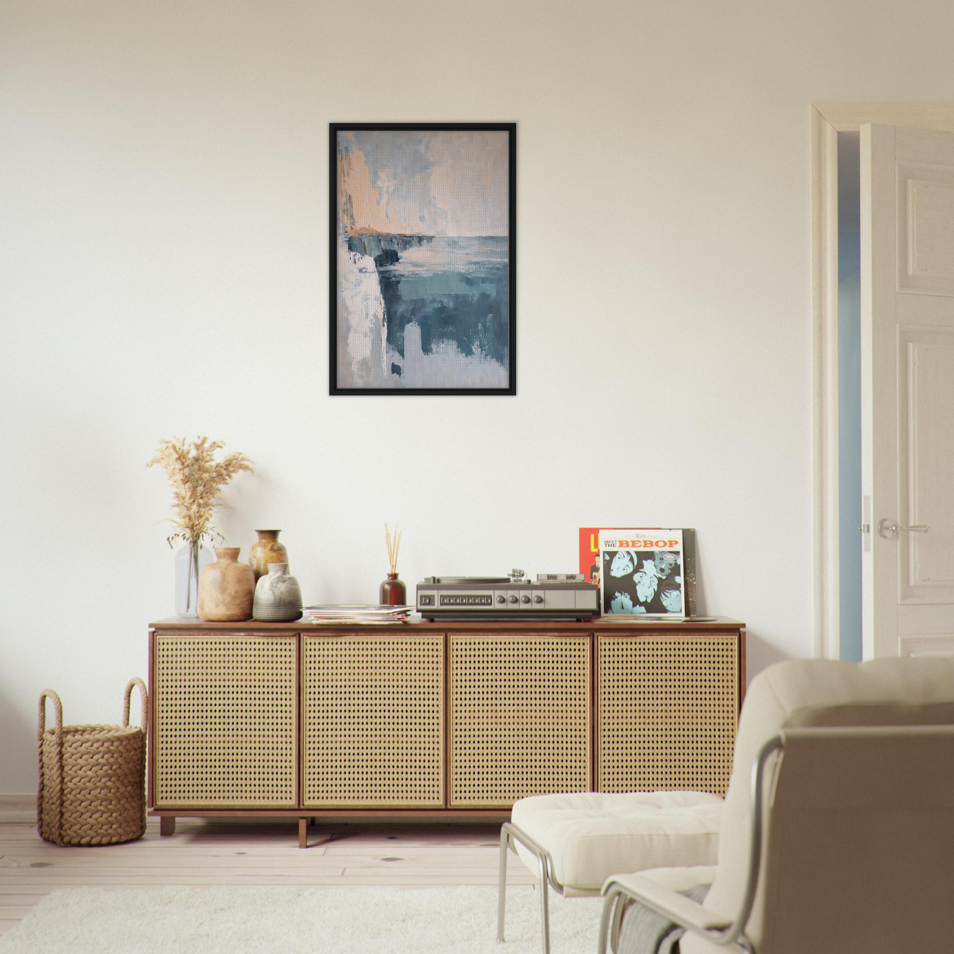 Wooden sideboard with cane-webbed doors atop Cerulean Cliff Unbound decor items