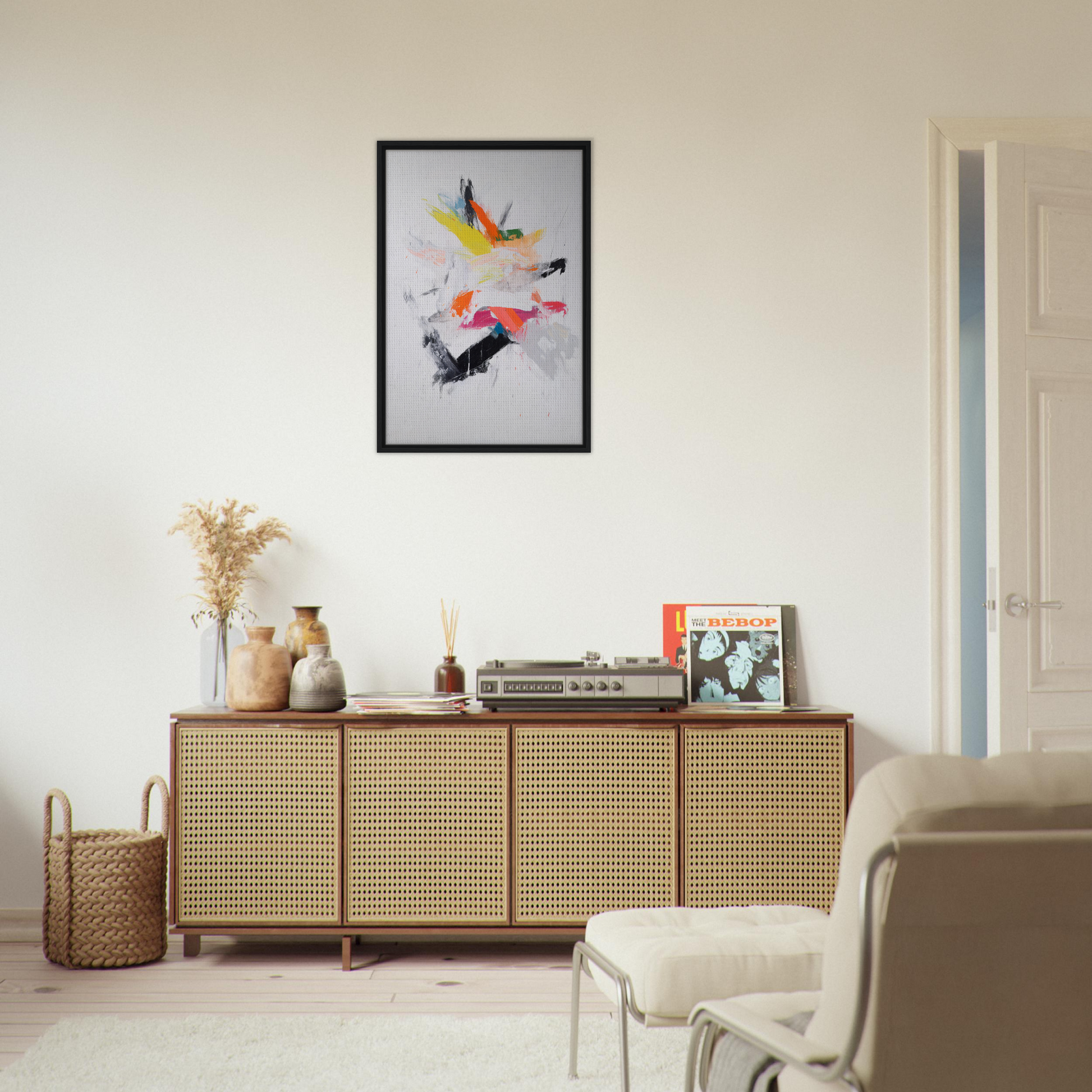 Wooden sideboard with cane-webbed doors showcasing decorative items and a Cosmic Tableau