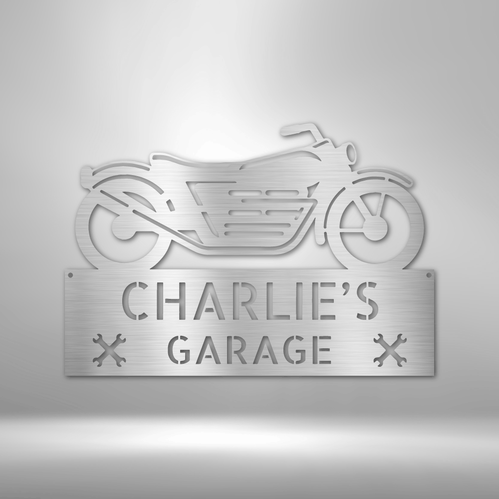 Metal sign featuring a motorcycle silhouette and the text ’CHARLIE’S GARAGE’.