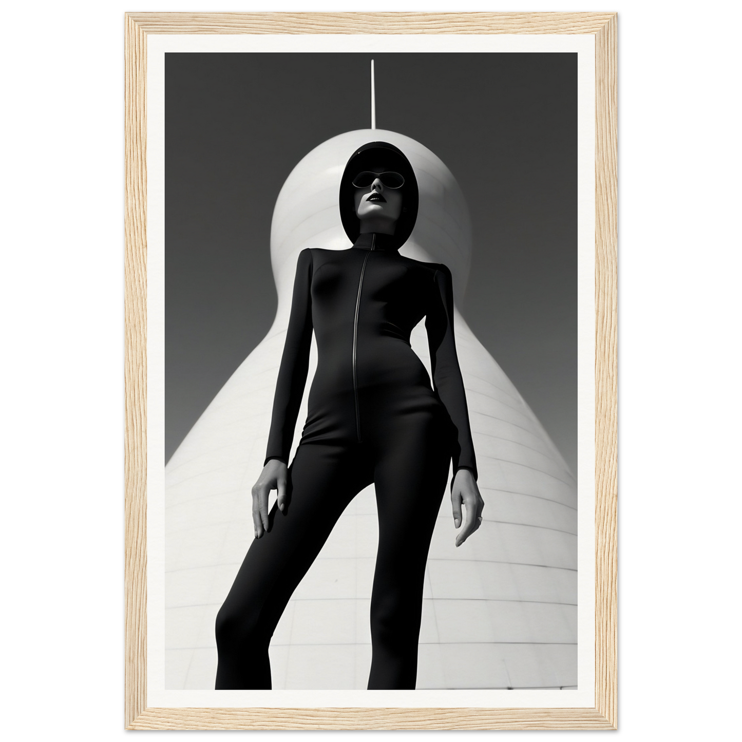 Silhouetted figure in a sleek black bodysuit striking a dramatic pose against a stark white backdrop.