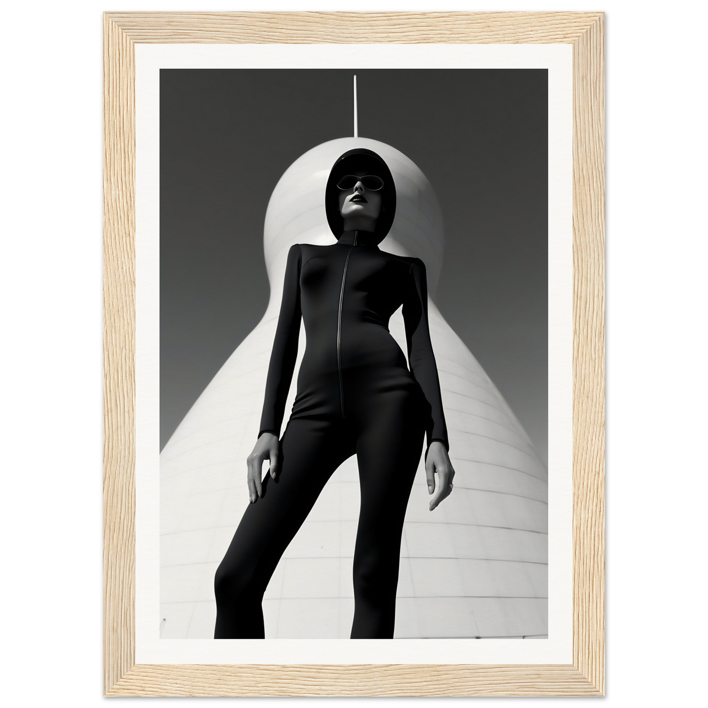 Silhouetted figure in a sleek black bodysuit standing beneath a curved white structure.