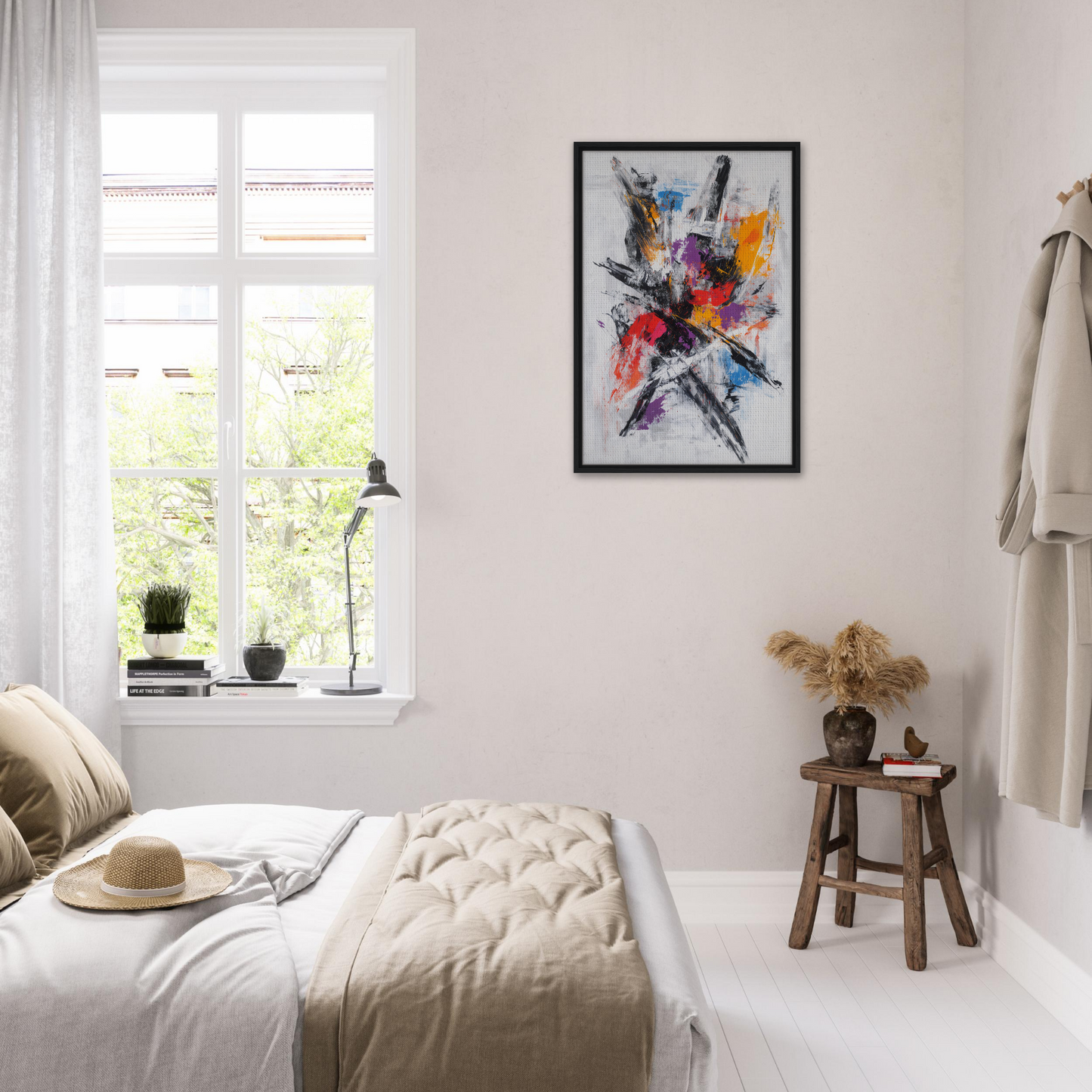 Bright, abstract painting in a black frame from Chromatic Chaos Ballet on a white wall