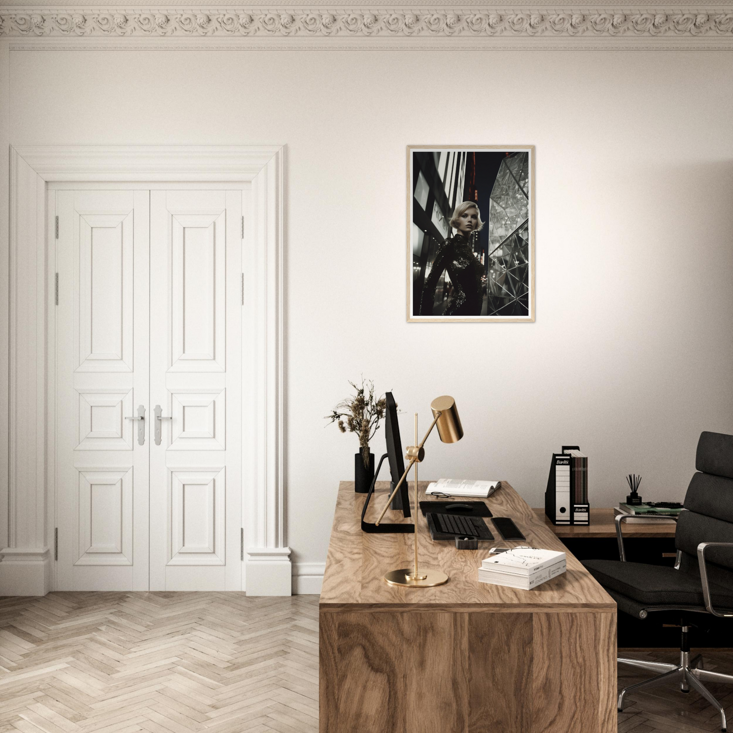 Wooden desk with office supplies and a framed photograph on the wall above it.