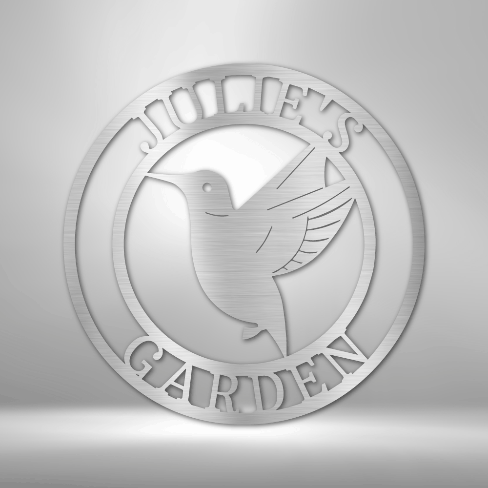 Circular logo featuring a hummingbird and the text ’JOHN’S GARDEN’.