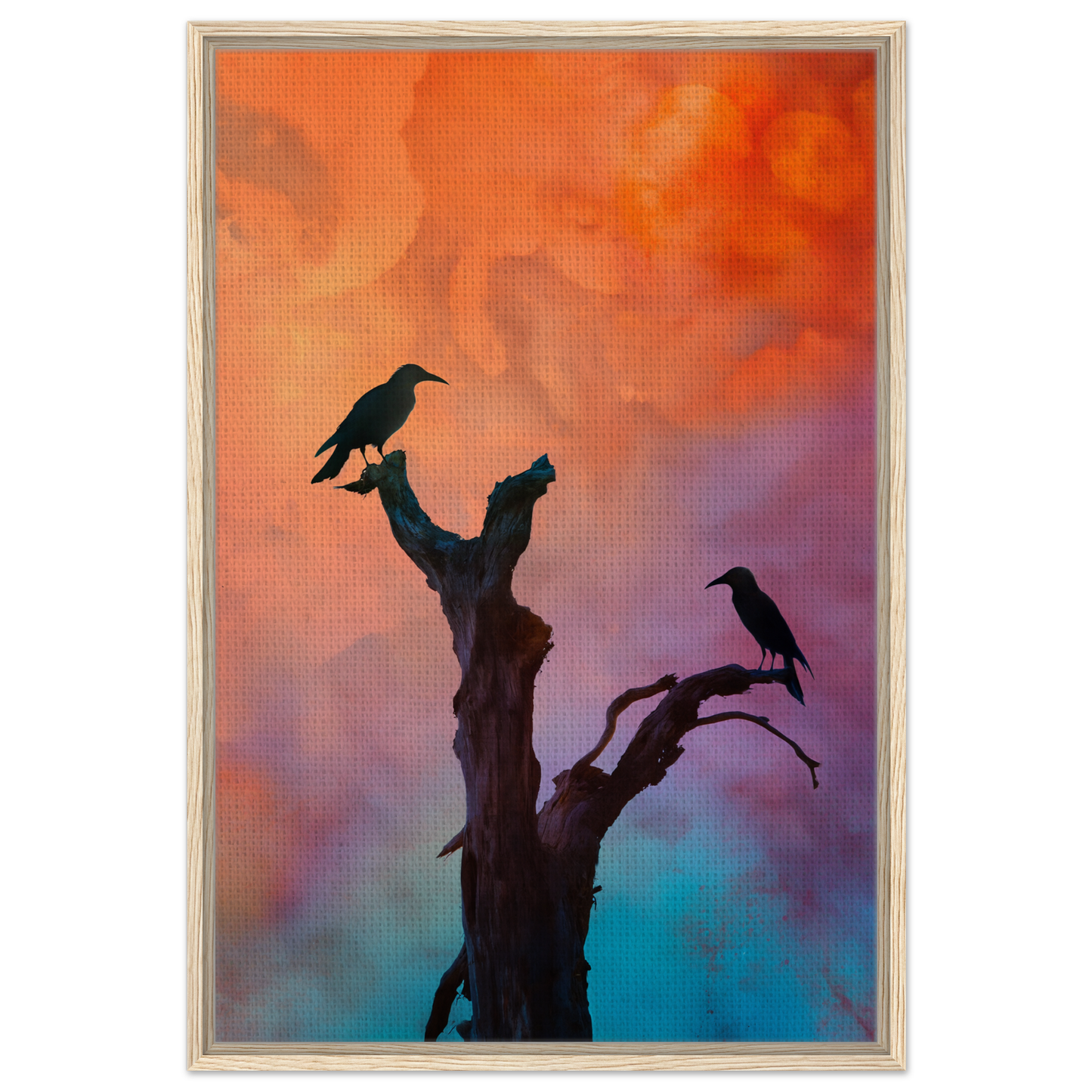 Silhouette of a bare tree with birds against a colorful sky in Crows’ Chromatic Psalms framed canvas print