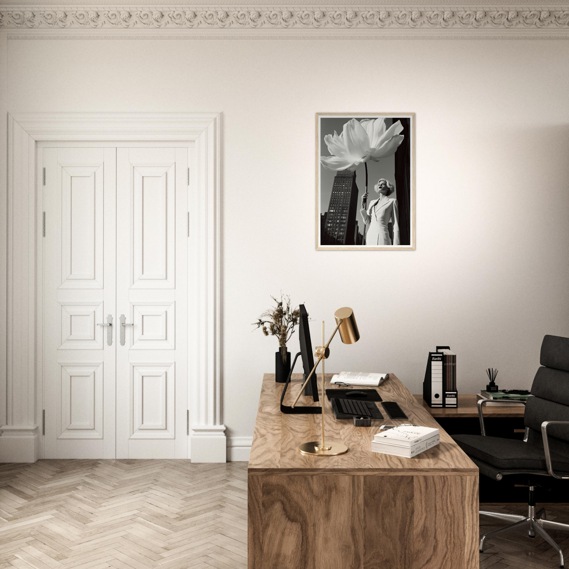 A desk with a chair and a framed photo on the wall