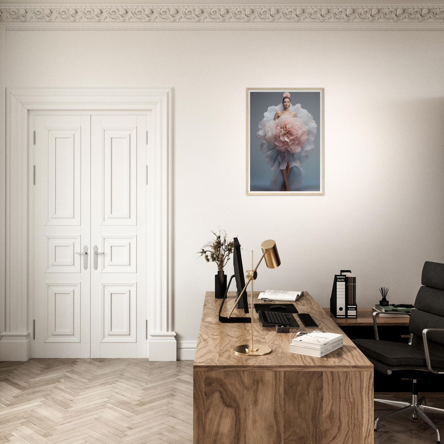 A desk with a chair and a painting on the wall