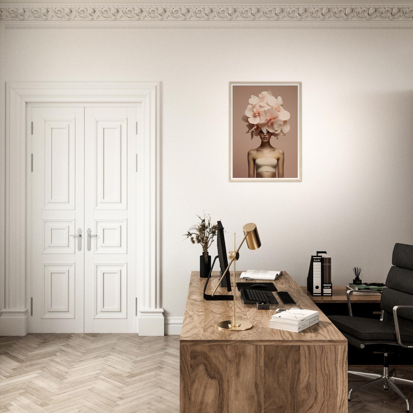 A desk with a chair and a painting on the wall