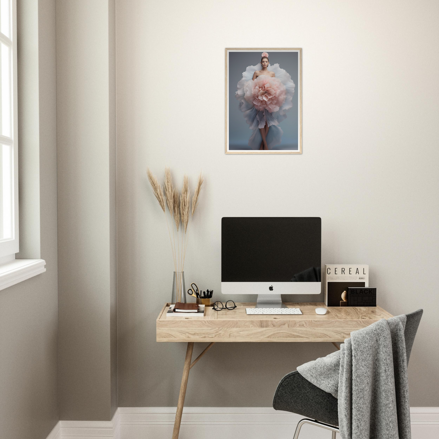 A desk with a computer and a plant on it