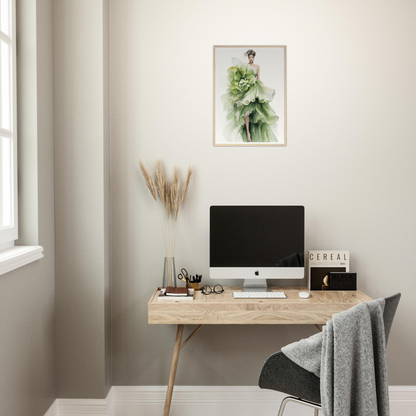 A desk with a computer and a plant on it