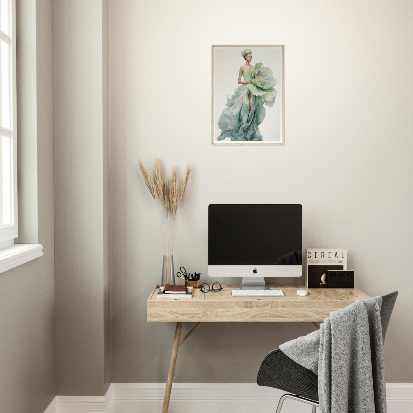 A desk with a computer and a plant on it