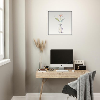 A desk with a computer and a plant on it