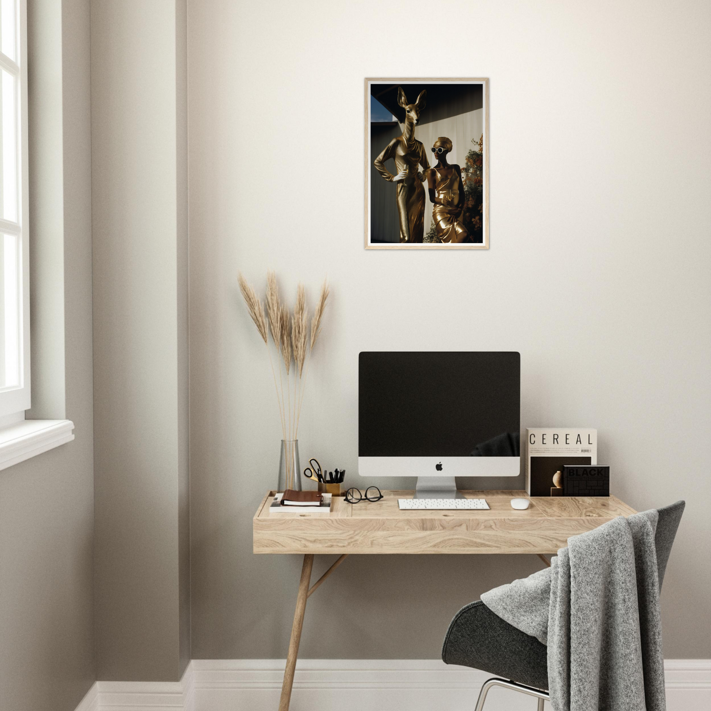 A desk with a computer and a plant on it