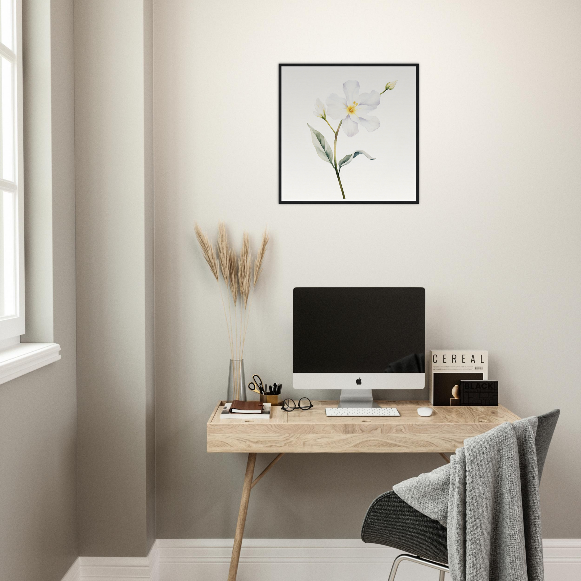 A desk with a computer and a plant on it