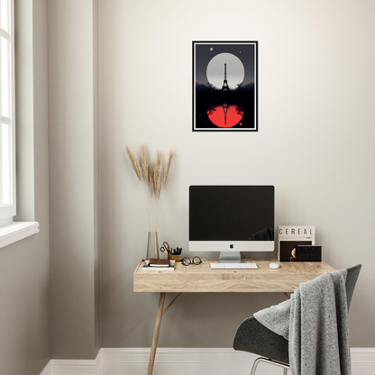 A desk with a computer and a poster on it