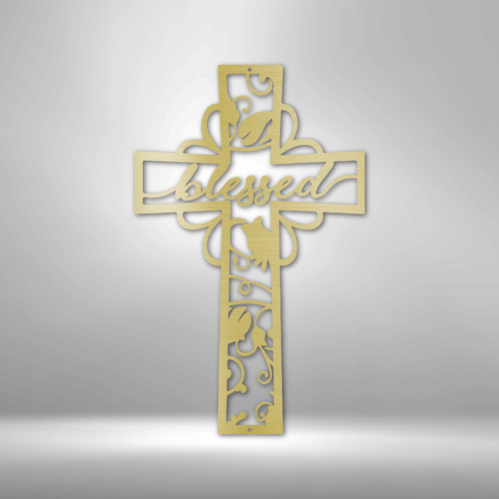 Decorative golden cross with the word ’Blessed’ and floral designs cut out.