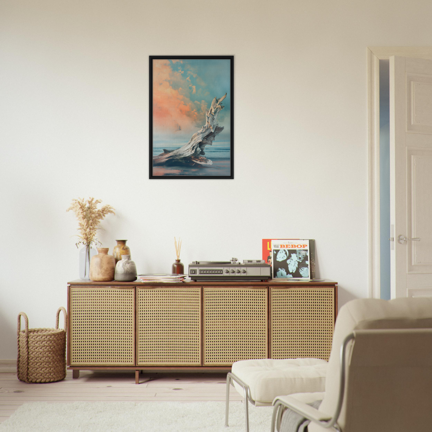 Wooden Driftwood Miragesauté sideboard with rattan panels and decorative framed canvas