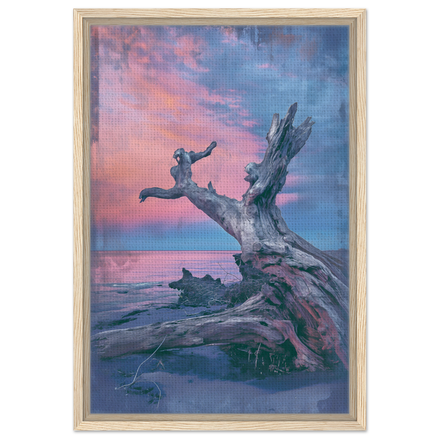 Driftwood tree trunk on a beach with a silhouetted jumper for Driftwood’s Eternity Canvas