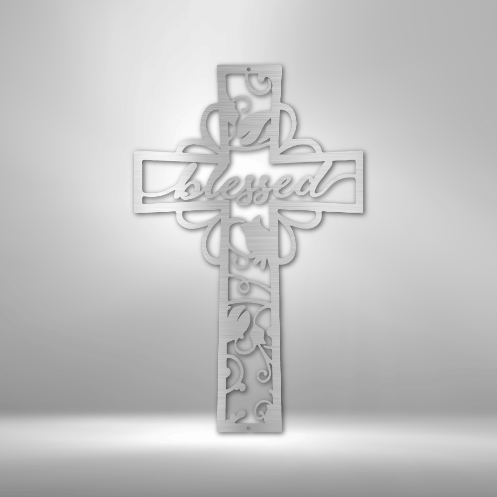 Ornate cross with the word ’Blessed’ and floral designs carved into its surface.