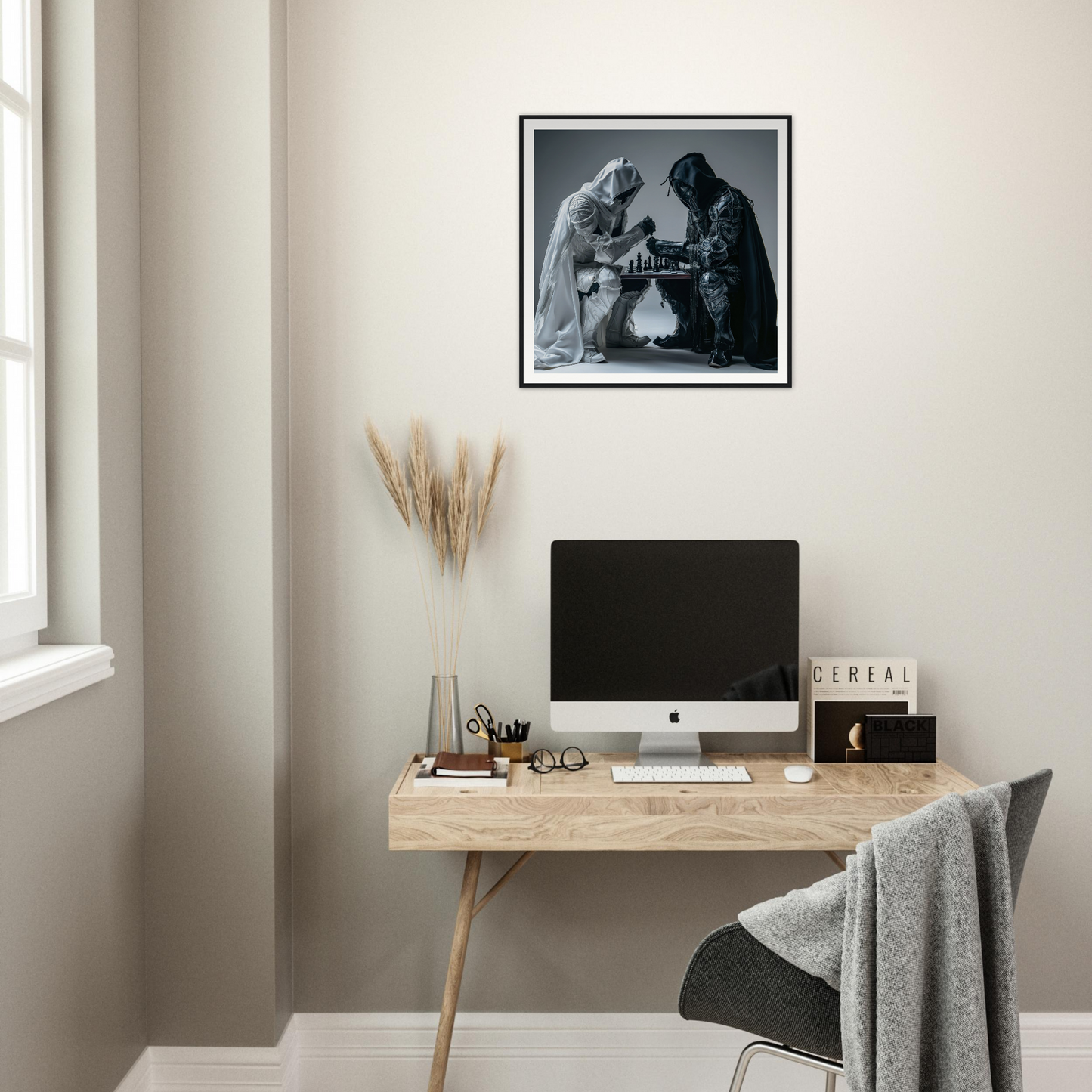 Minimalist wooden desk with iMac and museum-quality framed poster from Duality Chess Dreamscape