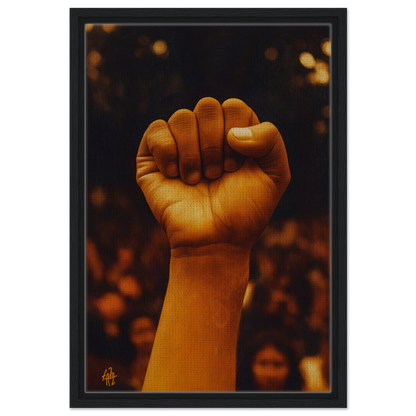 A raised fist in warm light symbolizes Earthy Defiance in Defiance Resonate framed canvas print