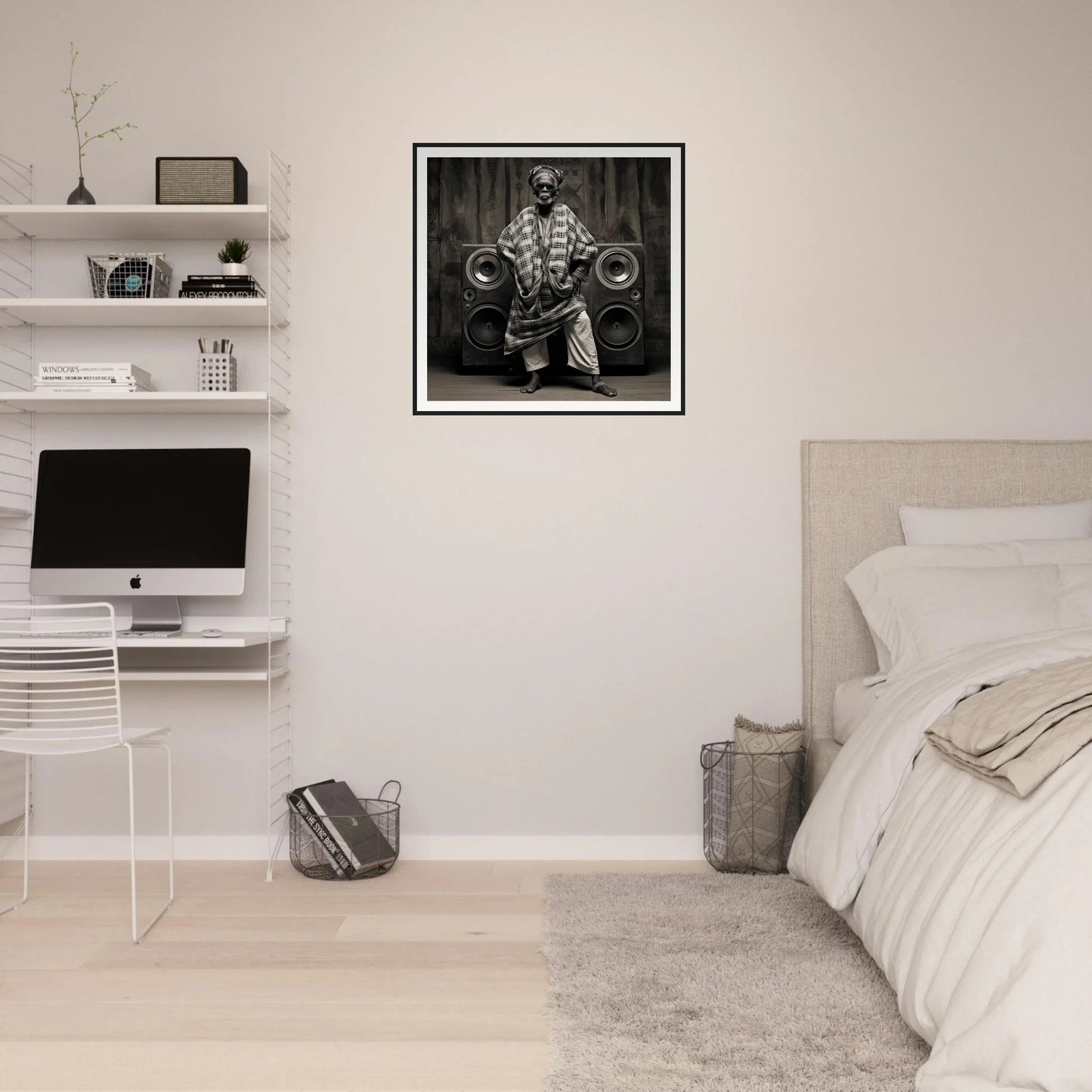 Minimalist bedroom featuring floating shelves, an iMac workstation, and museum-quality framed black art