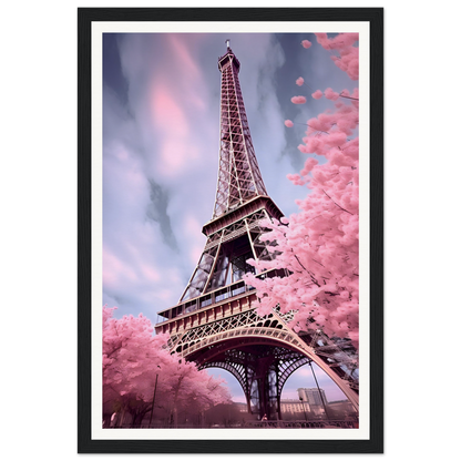 Eiffel Tower surrounded by pink cherry blossom trees.