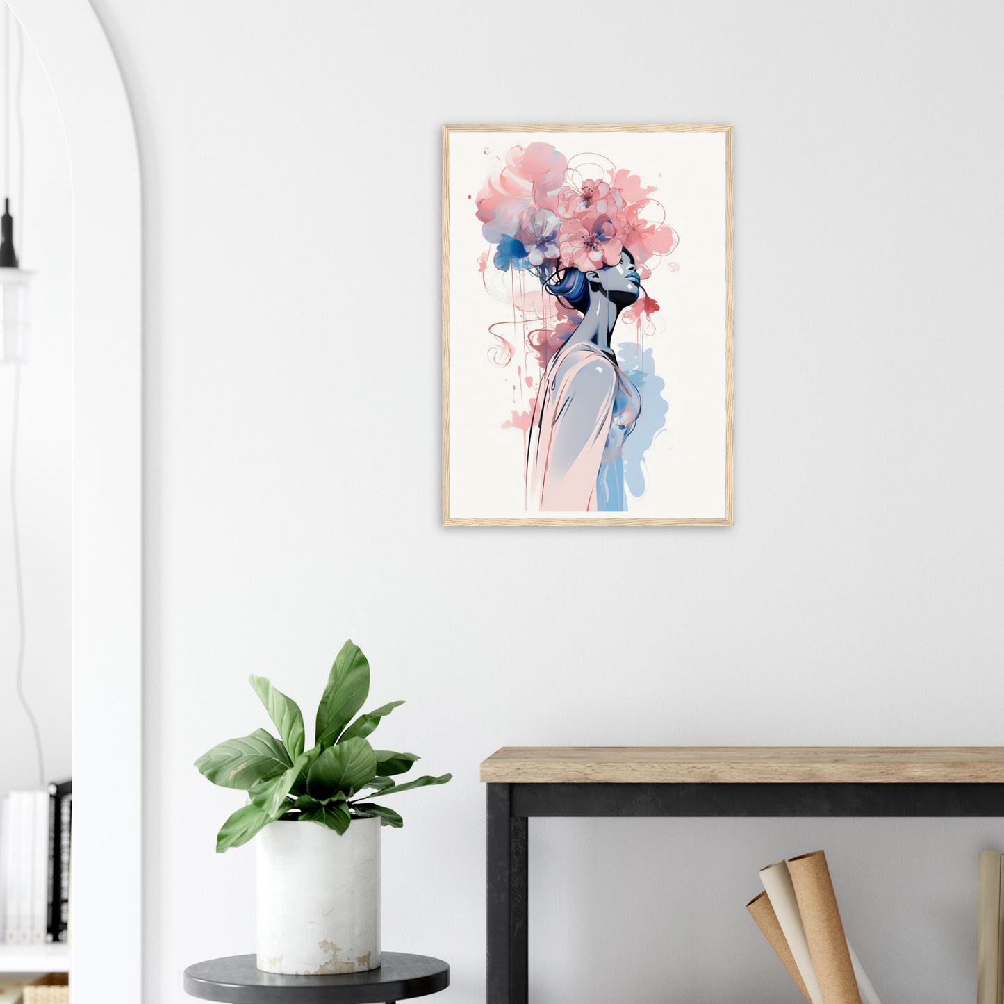 Framed watercolor painting of a figure with floral elements atop their head.