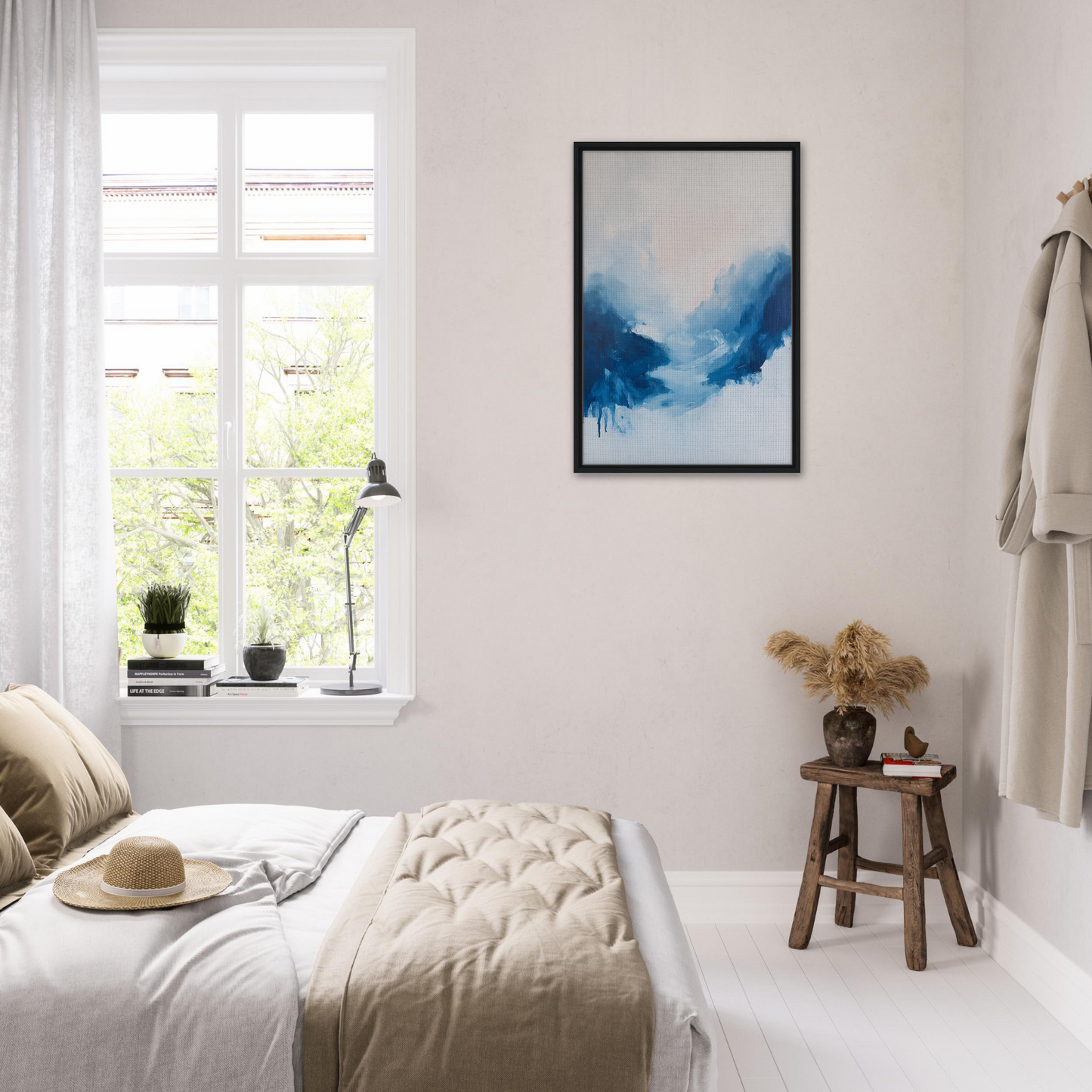 Bright airy bedroom with white decor and blue abstract art for Fluid Luminosity Wanders